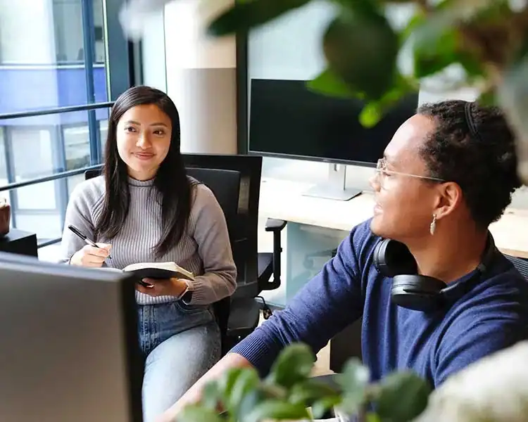 Two people collaborating in an office.